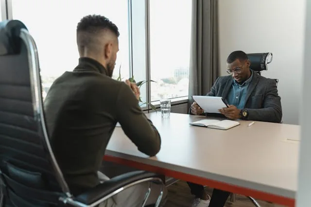 Property manager interviewing a prospective tenant in Allied Gardens